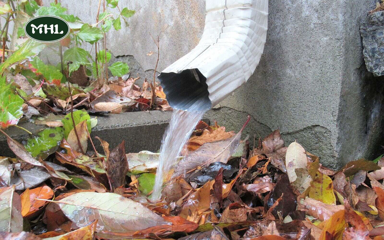 10 Ways To Fix Soft Spots In Yard: Redirect Downspouts To Avoid Pooling