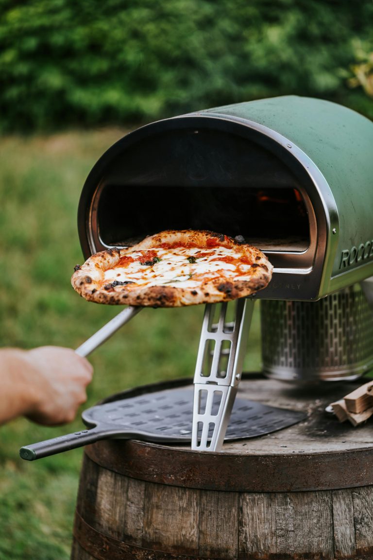 a pizza being cooked in a small oven