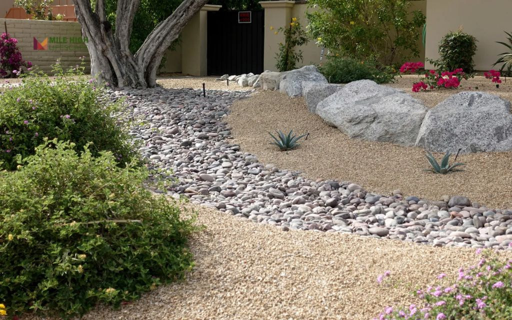 Dry Creek Bed with Mixed Rock Sizes and Mulch Edges