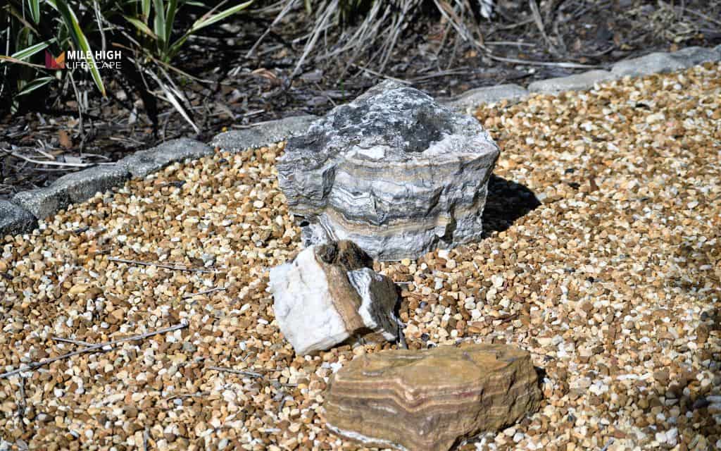 Why do landscape rocks sink into the ground?