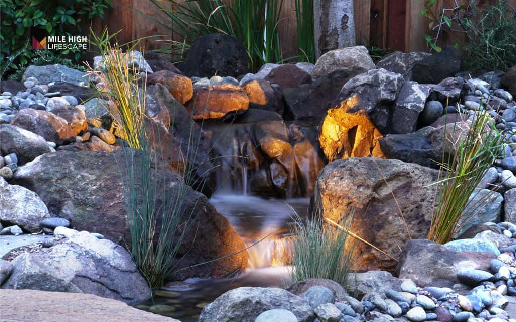 Water-wise pondless waterfall with rocks