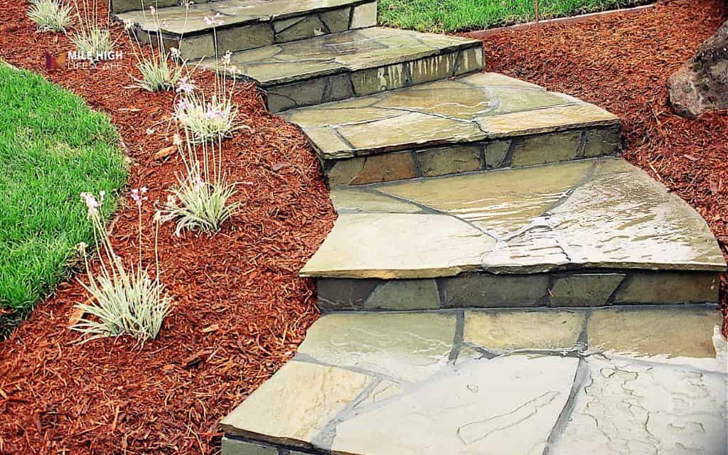 Flagstone steps on a sloped yard