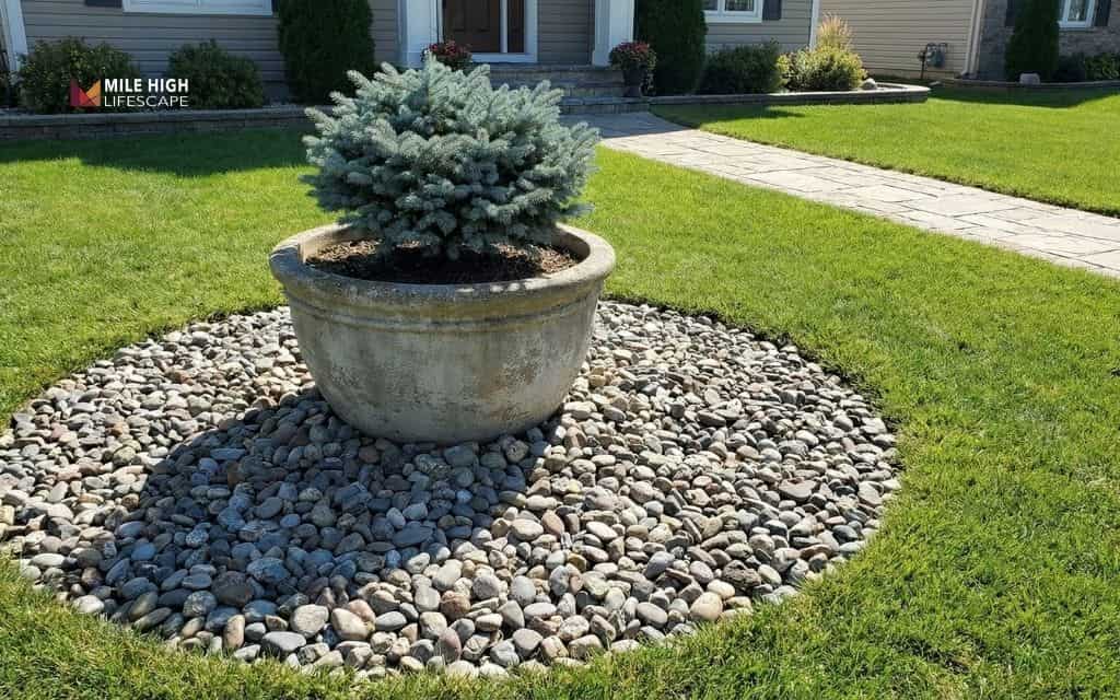 Front yard centerpiece with large pots on a rock base