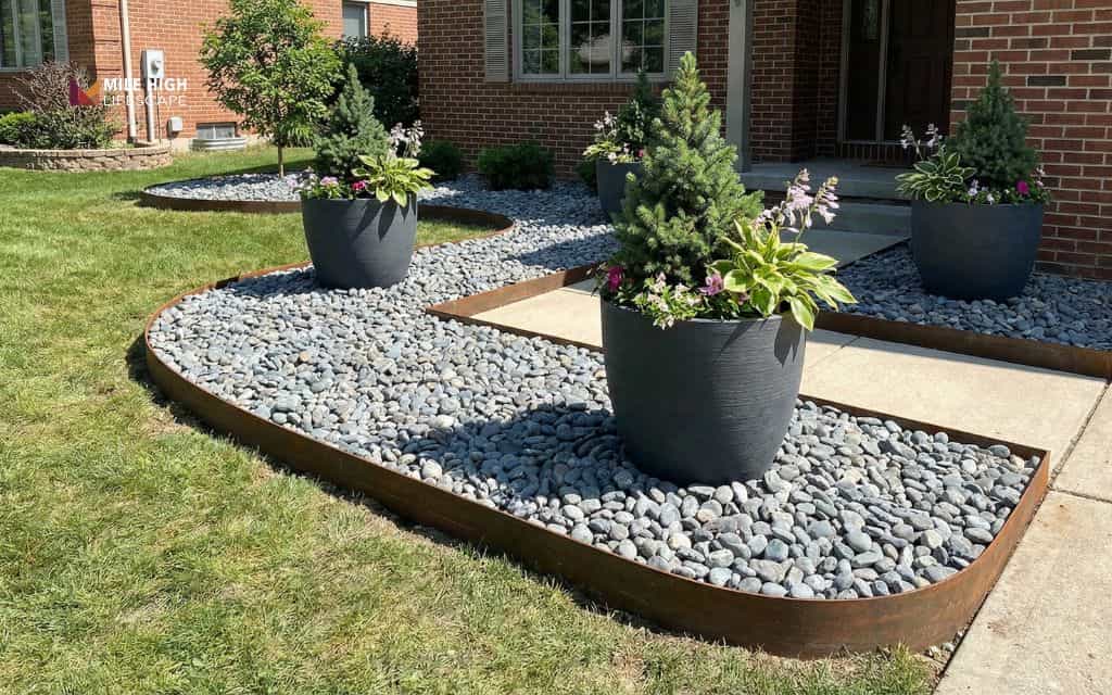 Front yard planters with rock borders