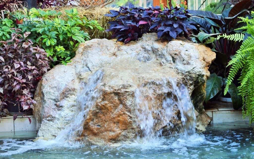 Single boulder bubbling rock fountain