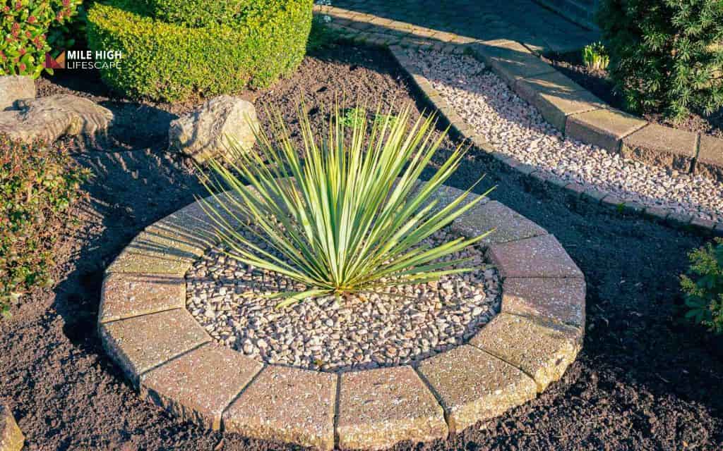 Flat rock accents in mulch beds