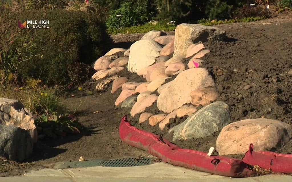Slope stabilization with large boulders
