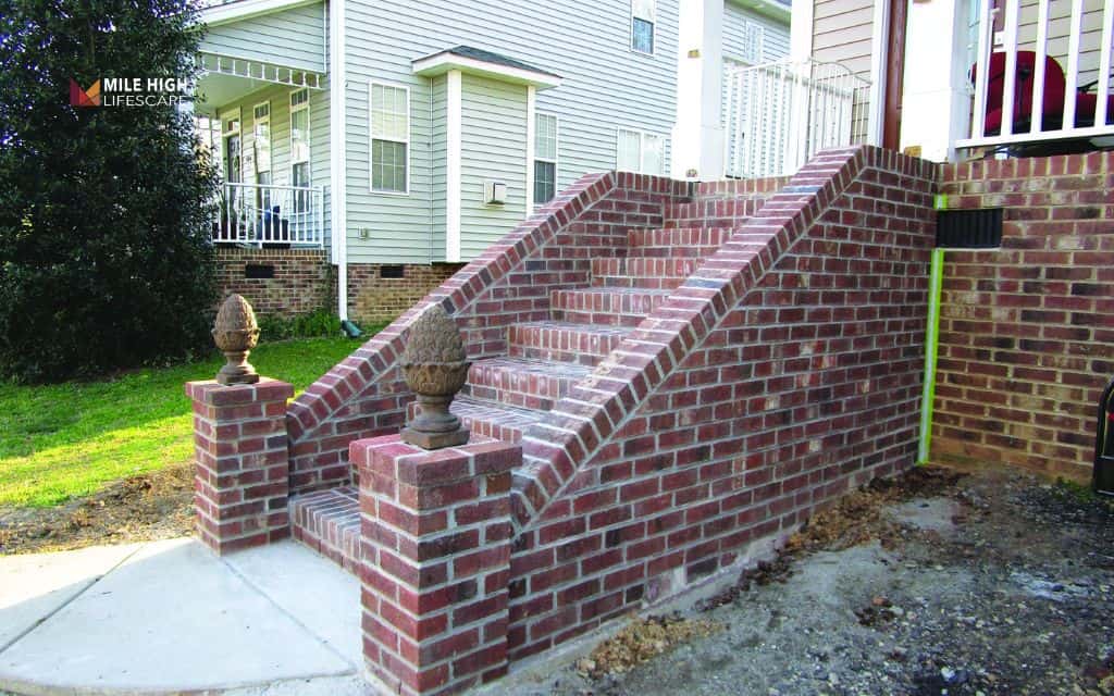 Hillside landscaping ideas: Add brick walls and stairways