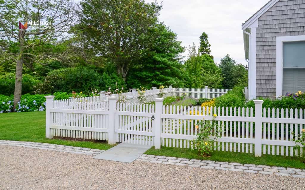 Front house fence ideas: Frame the driveway with coordinated fencing