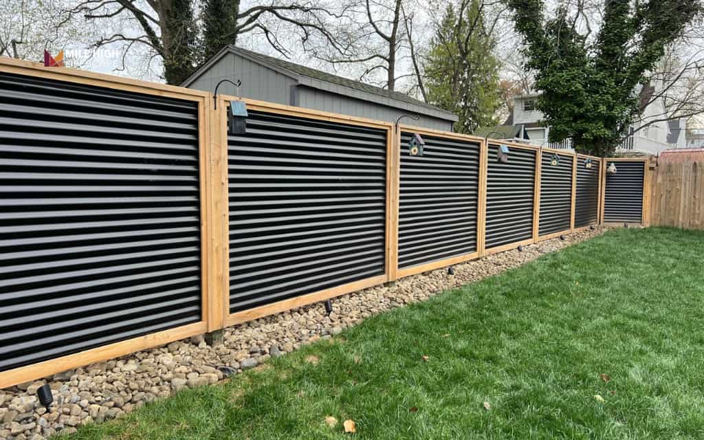 Front house fence ideas: Mixed-material fence with wood and metal