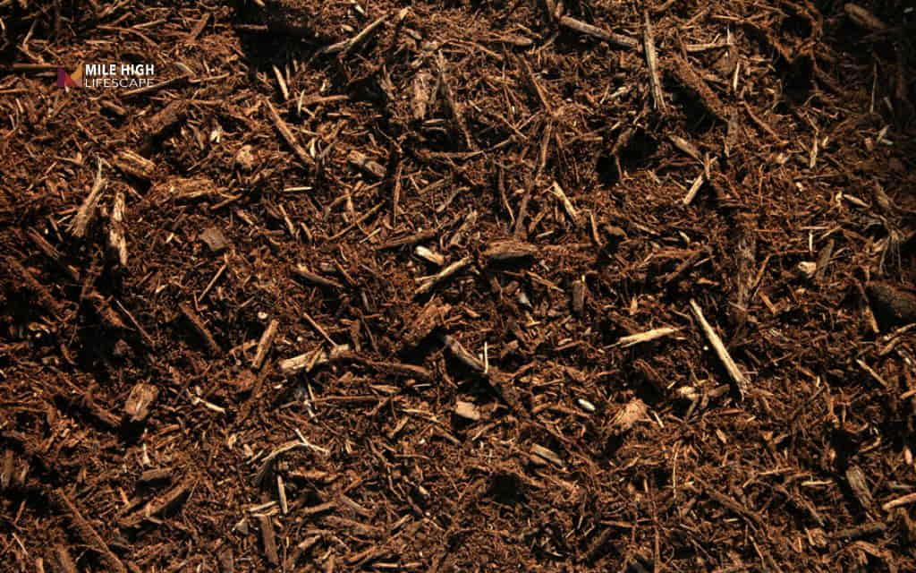 how to keep mulch in place: Use heavier mulch options